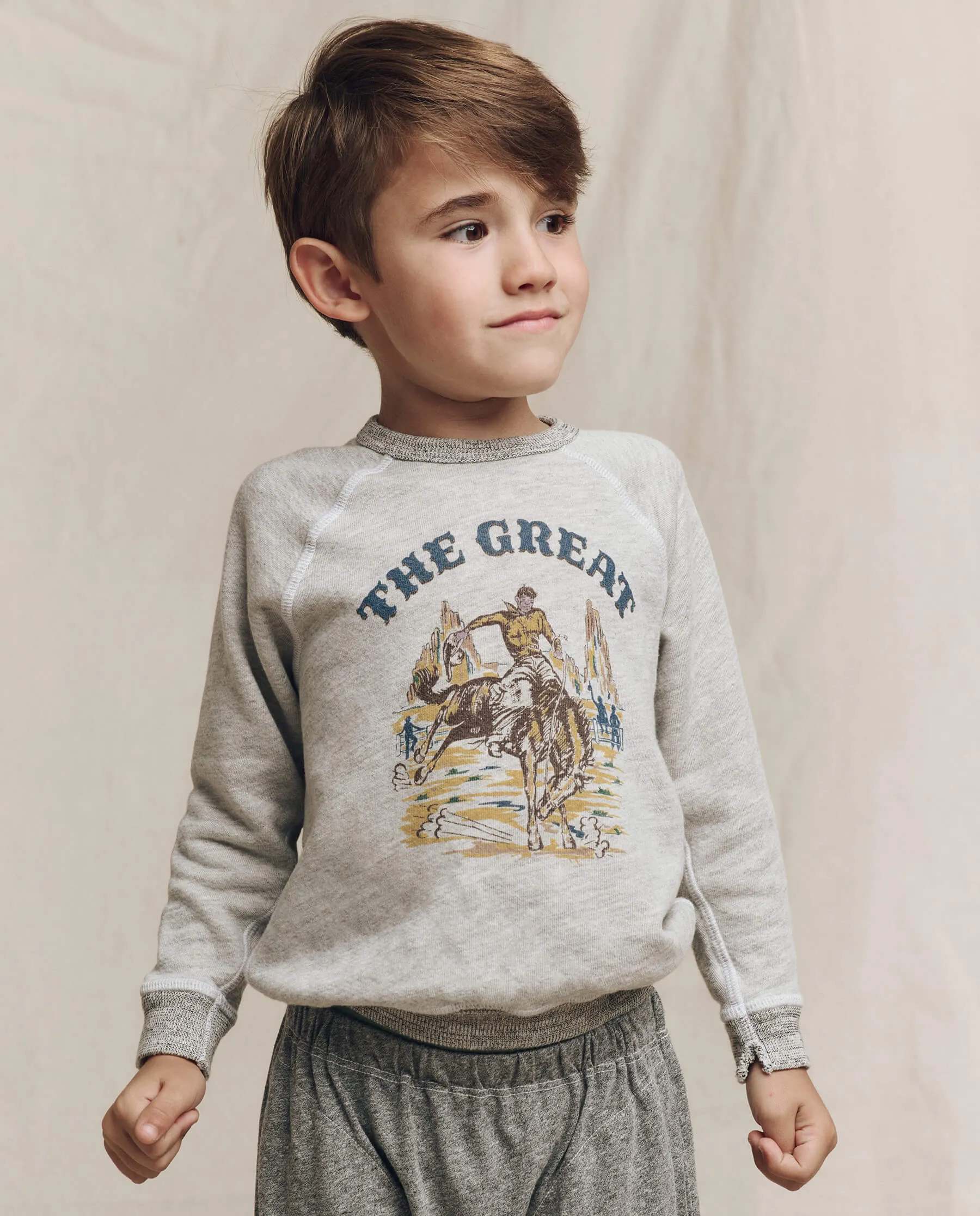 The Little College Sweatshirt. Graphic -- Soft Heather Grey with Rodeo Graphic